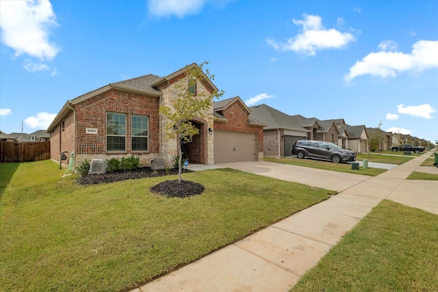 view of front of property featuring a garage and a front lawn