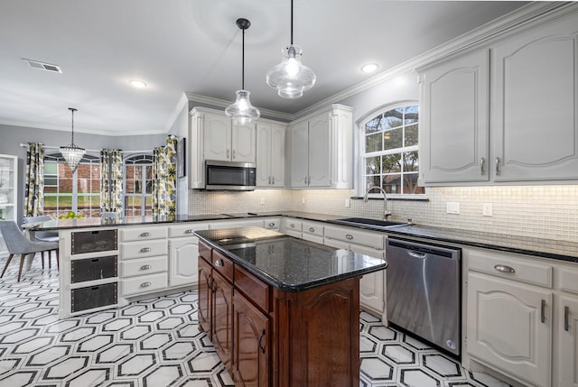 kitchen with white cabinetry, sink, and stainless steel appliances