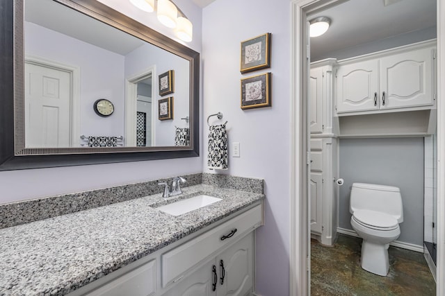 bathroom featuring vanity and toilet