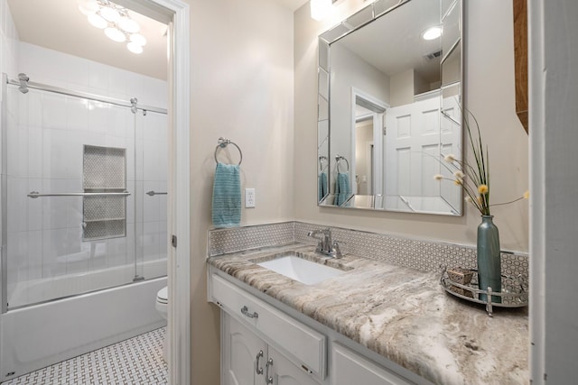 full bathroom with vanity, tile patterned flooring, toilet, and combined bath / shower with glass door