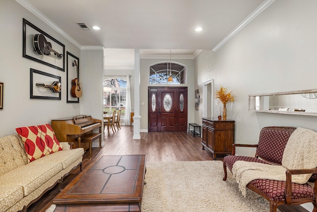 foyer entrance with dark wood-type flooring and ornamental molding