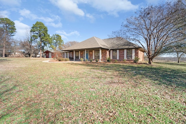 single story home featuring a front yard