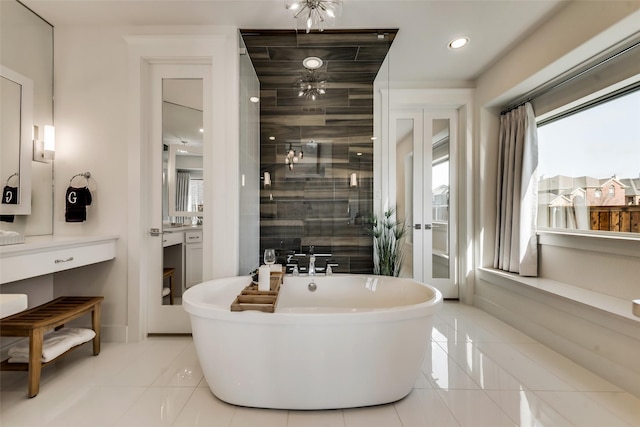 bathroom featuring plus walk in shower and tile patterned floors