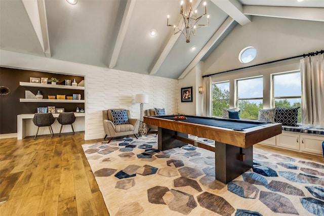 playroom featuring high vaulted ceiling, an inviting chandelier, light hardwood / wood-style flooring, pool table, and beamed ceiling