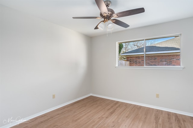 empty room featuring ceiling fan and hardwood / wood-style flooring