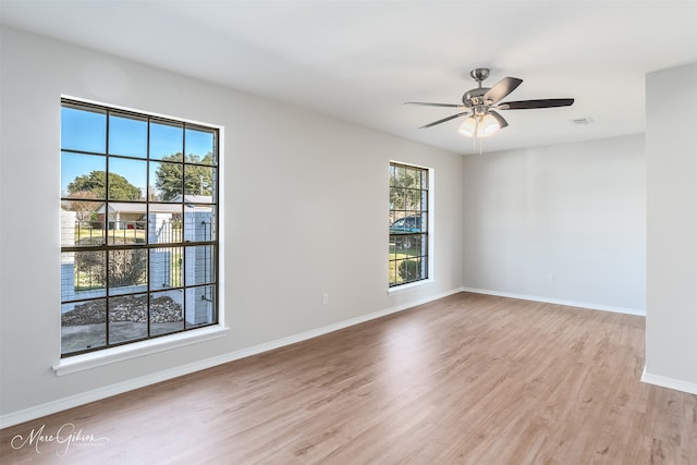 unfurnished room featuring light hardwood / wood-style floors and ceiling fan