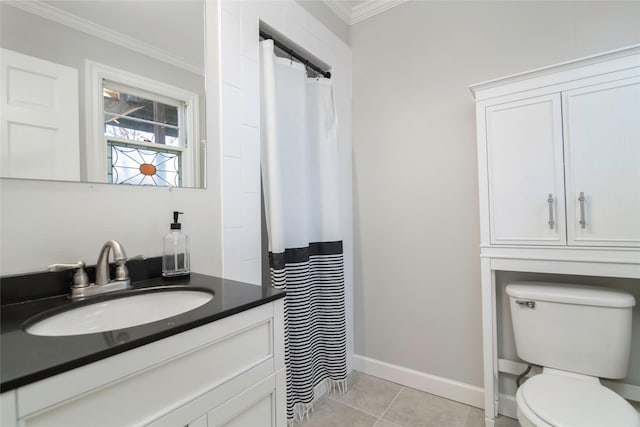 bathroom featuring tile patterned flooring, vanity, crown molding, and toilet