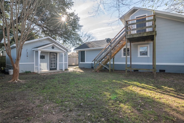 rear view of house with a lawn