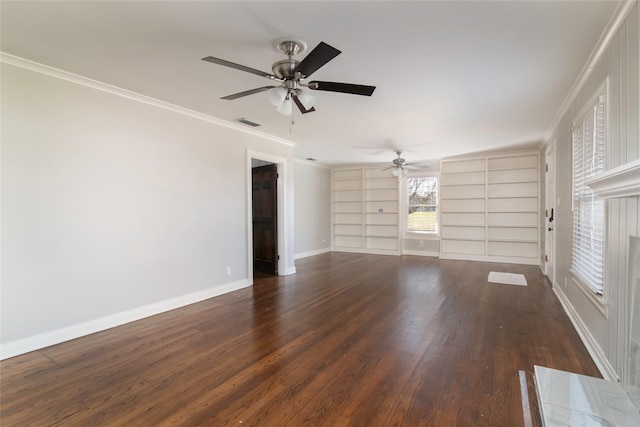 spare room featuring ornamental molding, dark wood-type flooring, ceiling fan, and built in shelves