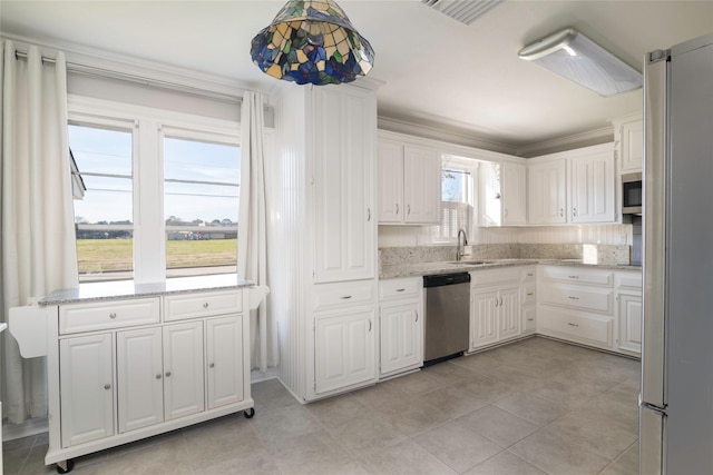 kitchen featuring white cabinets, crown molding, sink, and stainless steel appliances