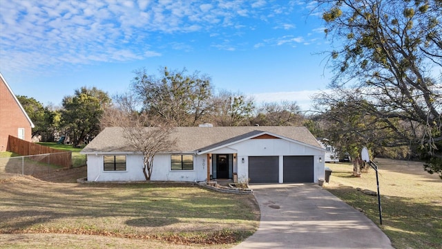 view of front facade featuring a garage and a front yard