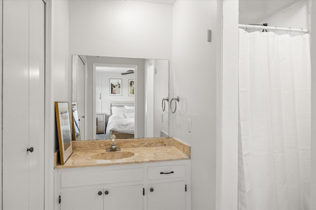 bathroom featuring ceiling fan and vanity