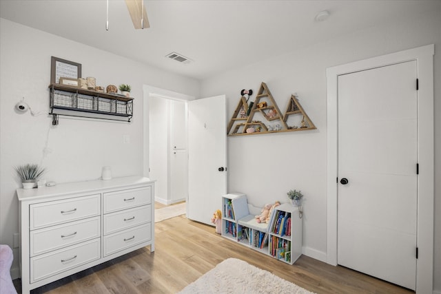 interior space with ceiling fan and light hardwood / wood-style floors