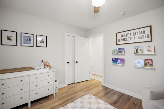 interior space with a closet, ceiling fan, and light hardwood / wood-style flooring