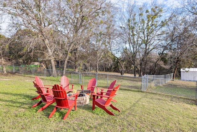 view of yard with a fire pit