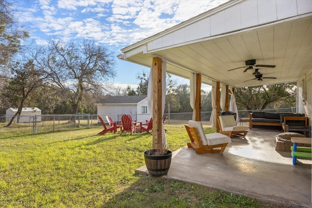 view of yard with ceiling fan, an outdoor hangout area, and a patio