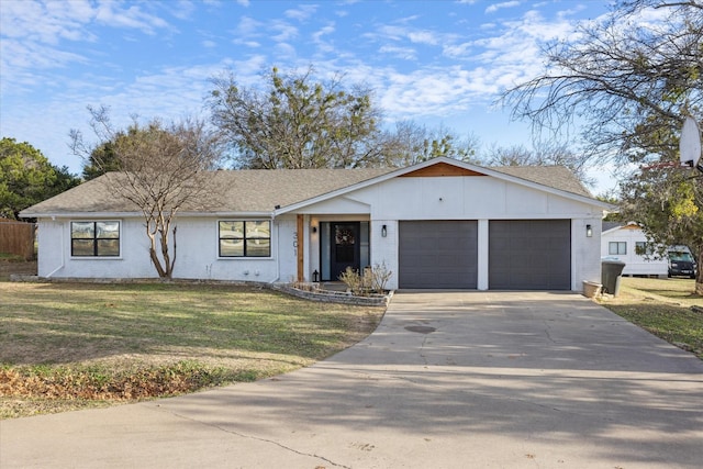 ranch-style house with a garage and a front lawn