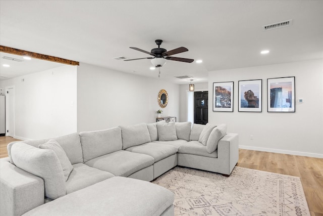 living room with ceiling fan and light hardwood / wood-style floors