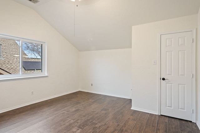 additional living space with lofted ceiling and dark wood-type flooring