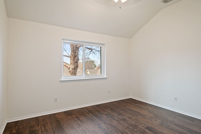 unfurnished room featuring dark hardwood / wood-style floors and lofted ceiling