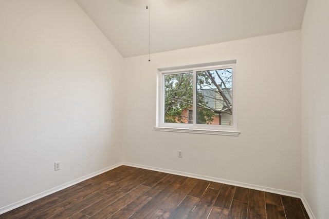 spare room with lofted ceiling