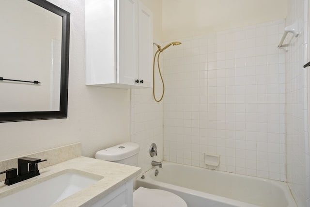 full bathroom featuring vanity, toilet, and tiled shower / bath