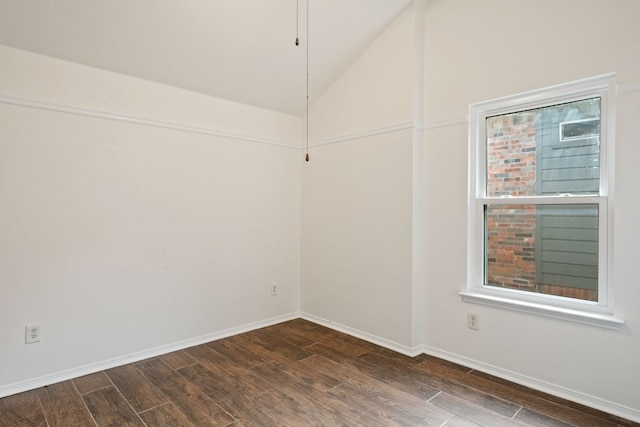 empty room featuring lofted ceiling