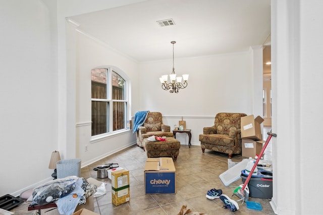 interior space with tile patterned floors, ornate columns, crown molding, and an inviting chandelier