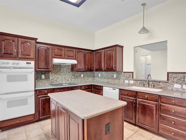 kitchen with sink, backsplash, decorative light fixtures, white appliances, and light tile patterned floors