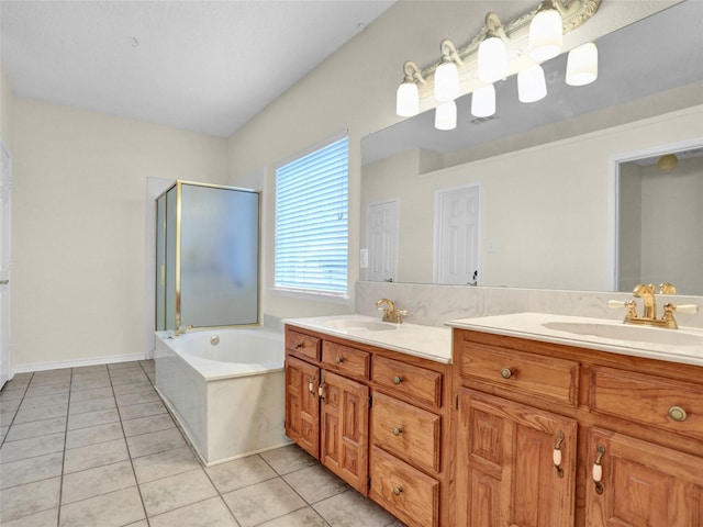 bathroom featuring tile patterned floors, vanity, and shower with separate bathtub