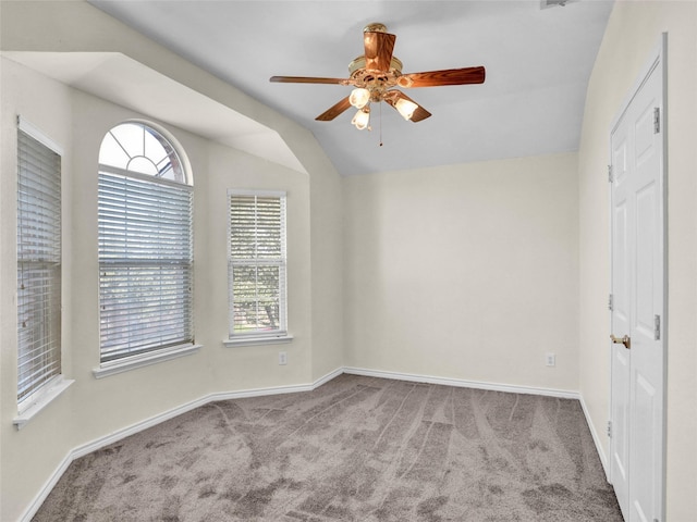 spare room with light carpet, ceiling fan, and lofted ceiling