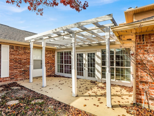 view of patio / terrace with french doors and a pergola