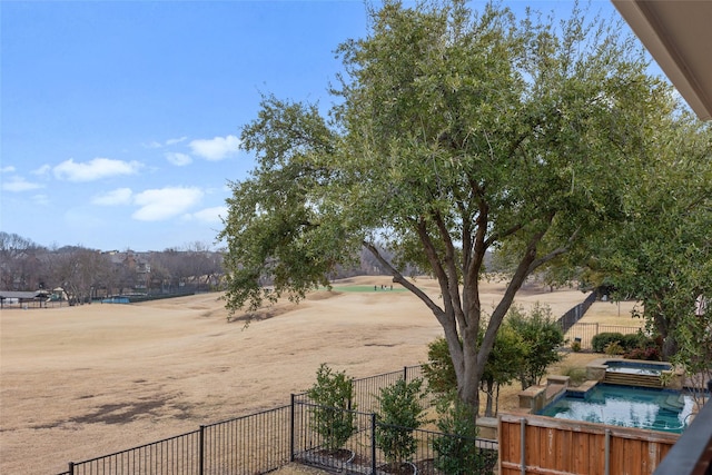 view of yard featuring an in ground hot tub