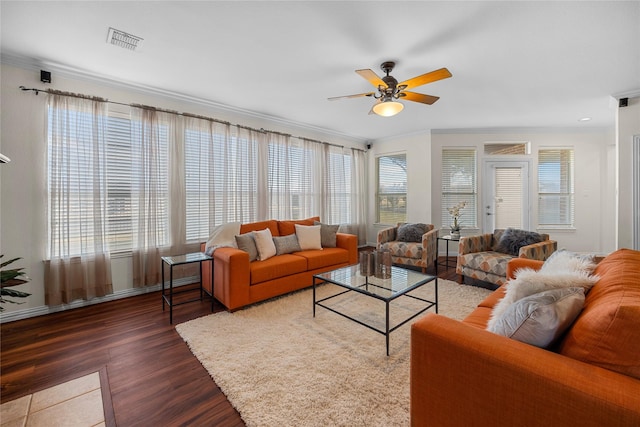 living room featuring crown molding, ceiling fan, and dark hardwood / wood-style flooring