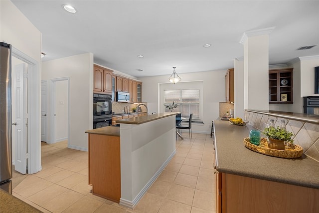 kitchen featuring pendant lighting, crown molding, stainless steel appliances, light tile patterned flooring, and decorative backsplash