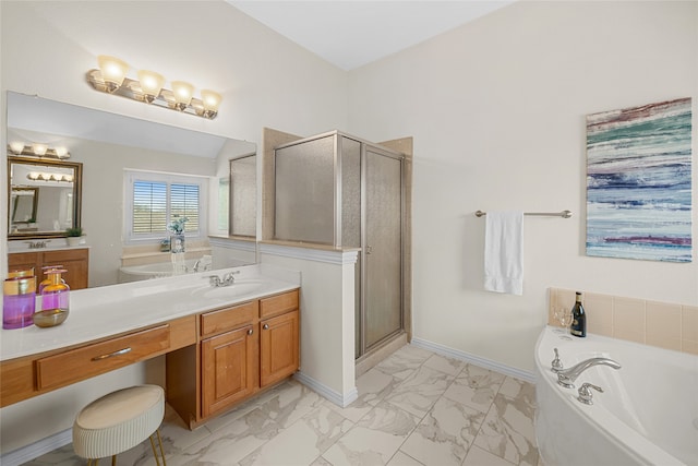 bathroom with vanity and separate shower and tub