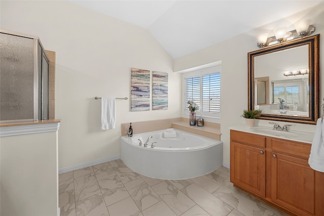 bathroom featuring lofted ceiling, shower with separate bathtub, and vanity