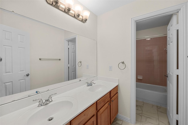 bathroom featuring vanity and tiled shower / bath combo