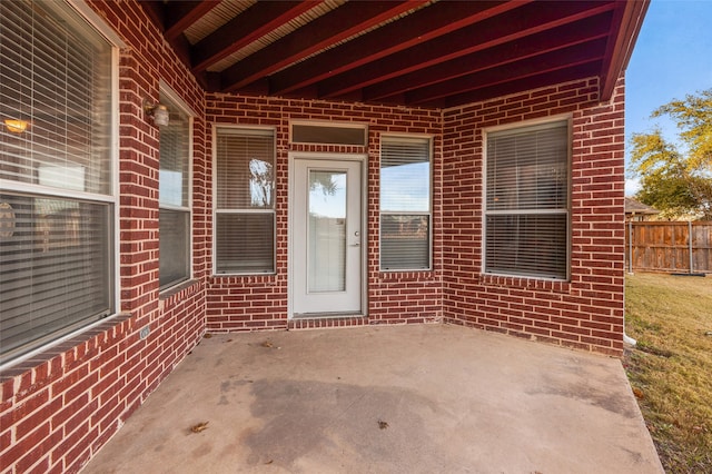 doorway to property featuring a patio area