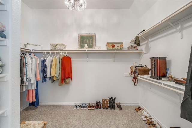 walk in closet featuring carpet