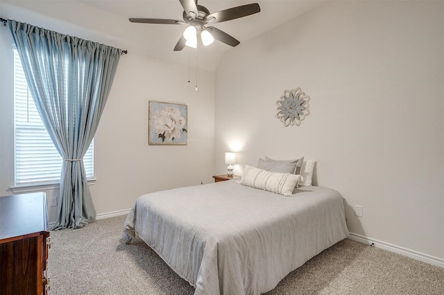 carpeted bedroom featuring vaulted ceiling and ceiling fan