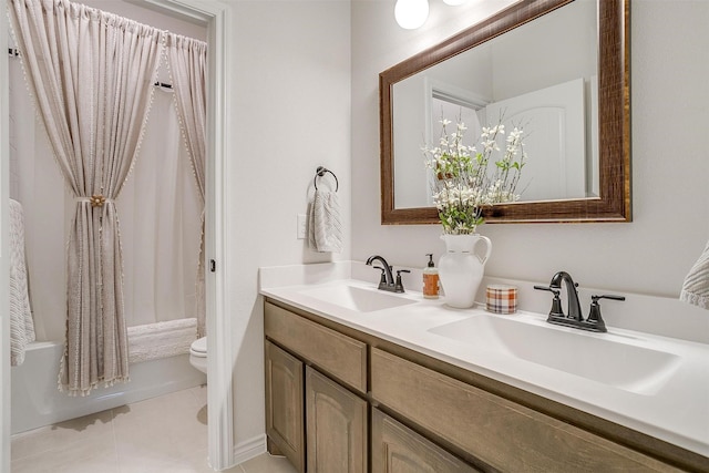 full bathroom with tile patterned flooring, shower / bath combo, toilet, and vanity