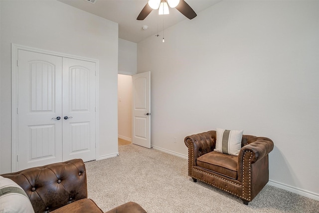 sitting room featuring ceiling fan and light colored carpet