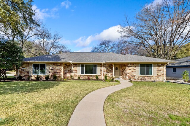 ranch-style home with a front lawn