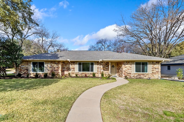 single story home featuring a front lawn