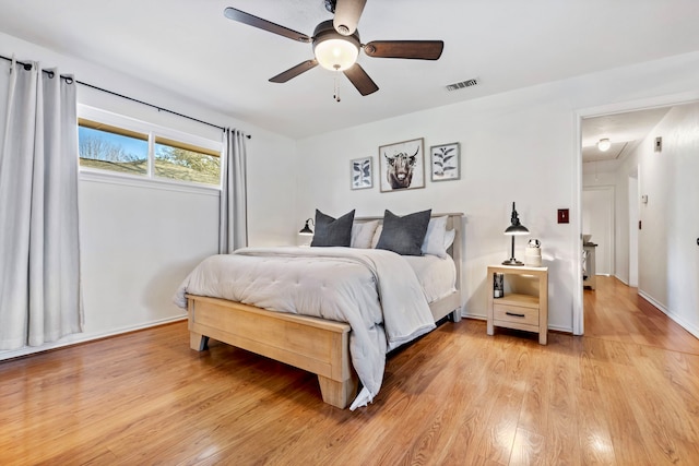 bedroom featuring ceiling fan and light wood-type flooring