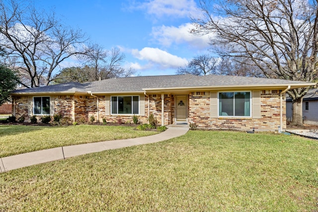 ranch-style house featuring a front lawn