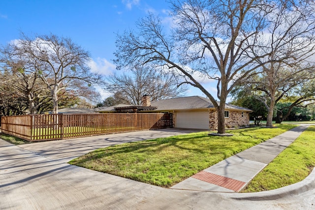 view of property exterior with a yard and a garage