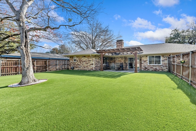 back of house featuring a pergola, a patio, and a lawn