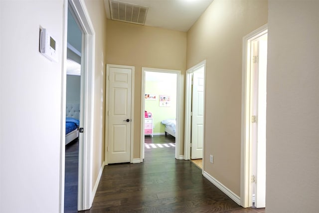 hallway featuring dark hardwood / wood-style floors